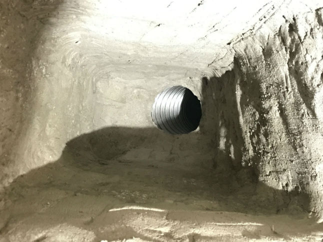 Traditions Chimney Sweep after parged chimney. Interior view of a parged smooth smoke chamber.